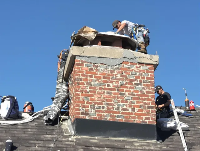 Naugatuck Chimney Sweep installing a custom chimney crown in Naugatuck, CT