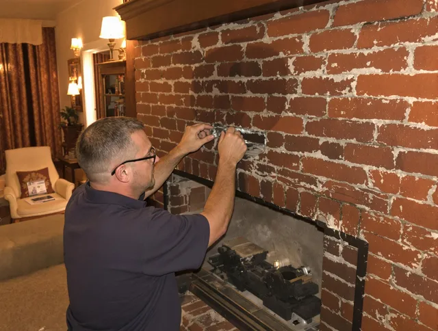 Naugatuck Chimney Sweep expert fixing a fireplace in Naugatuck, CT